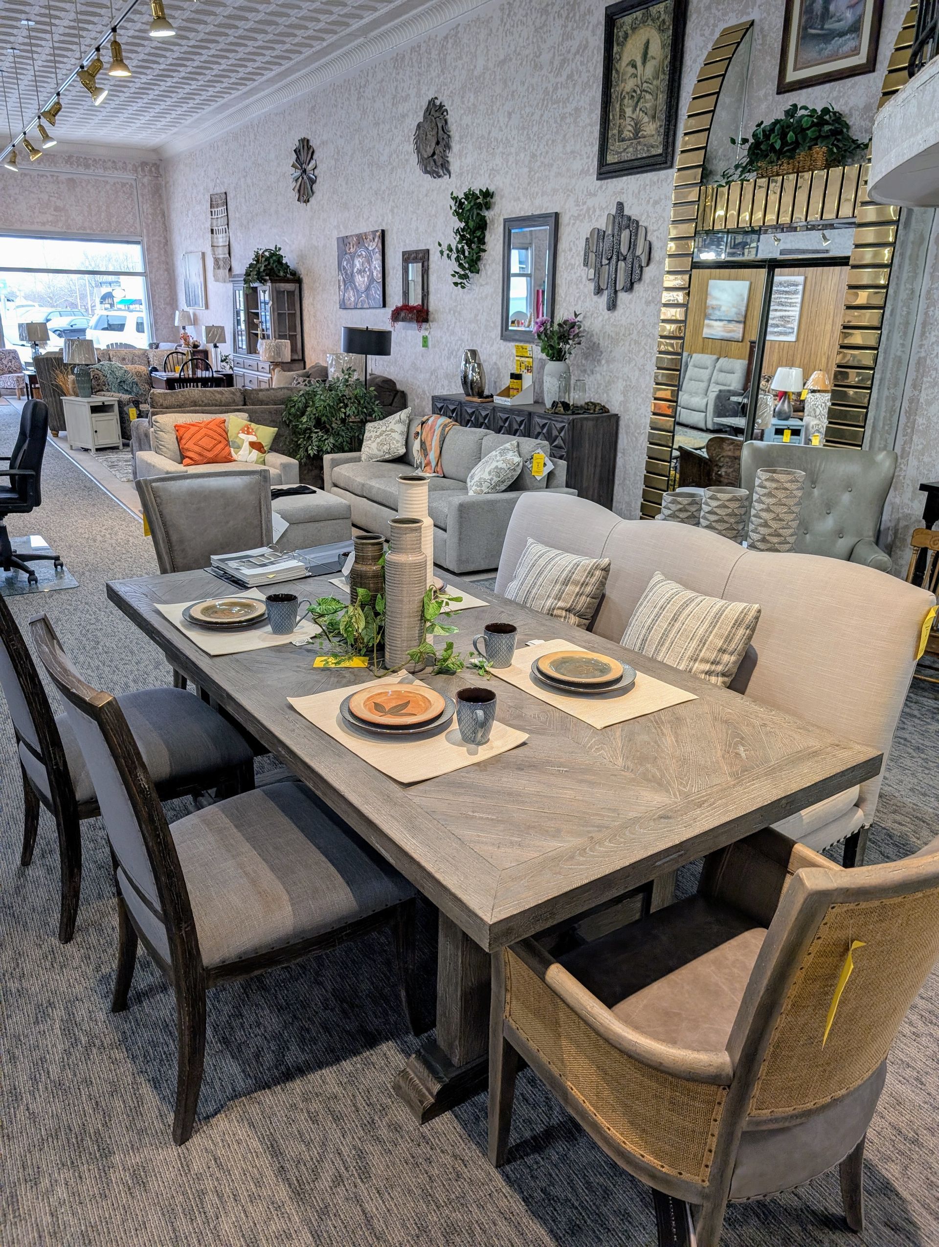 A dining room table and chairs in a store.