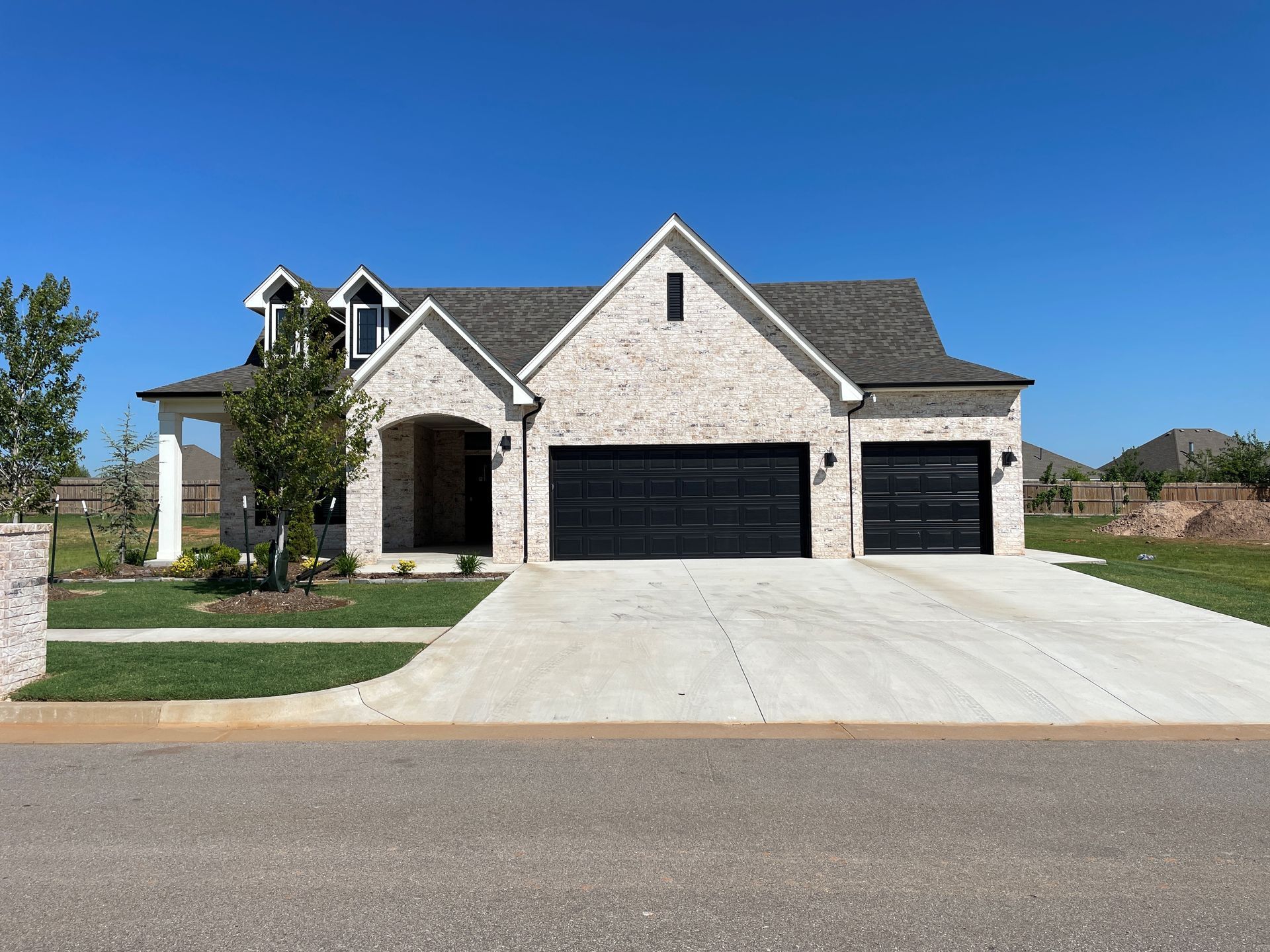 Crystal Creek -Luxury home with dark garage door