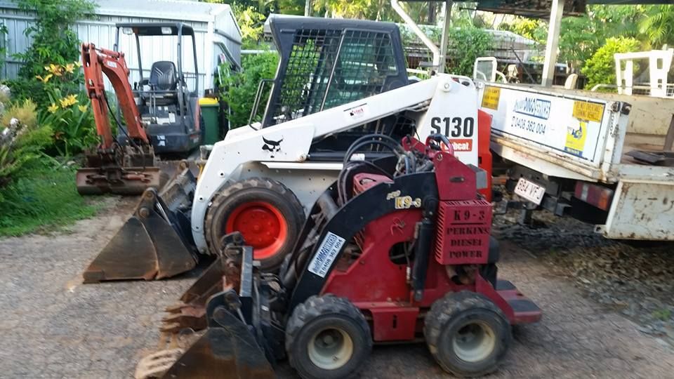 A Bobcat S130 Is Parked Next To A Small Excavator — Absolute Dingo Services in White Rock, QLD