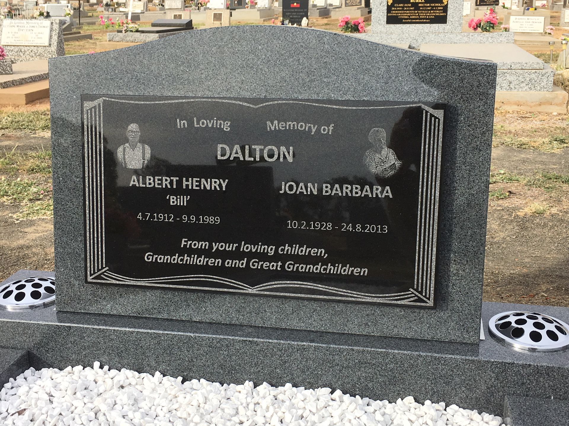 A gravestone for albert henry dalton and joan barbara
