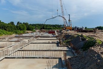 a crane is working on a construction site