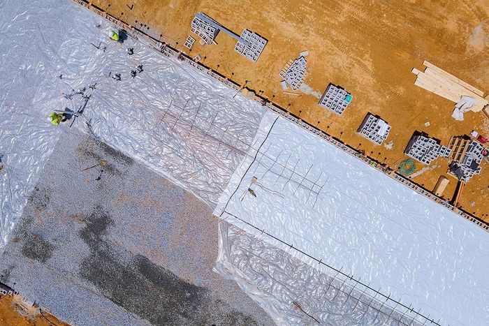 an aerial view of a construction site with workers