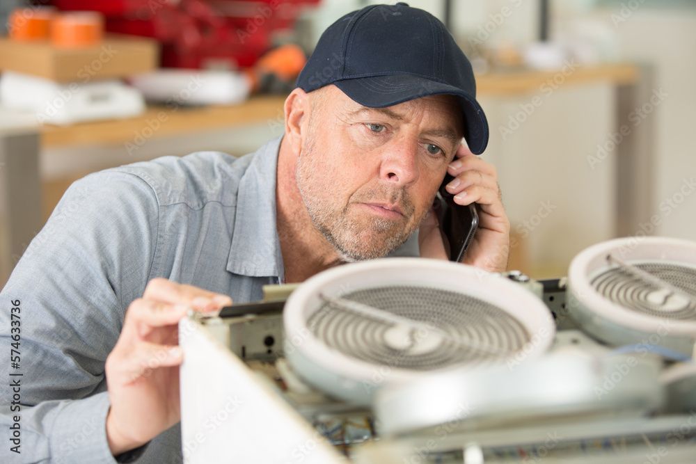 two bottles of water filter cartridges are sitting next to each other on a white surface .