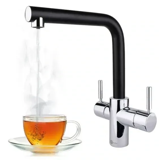a cup of tea is being poured from a faucet