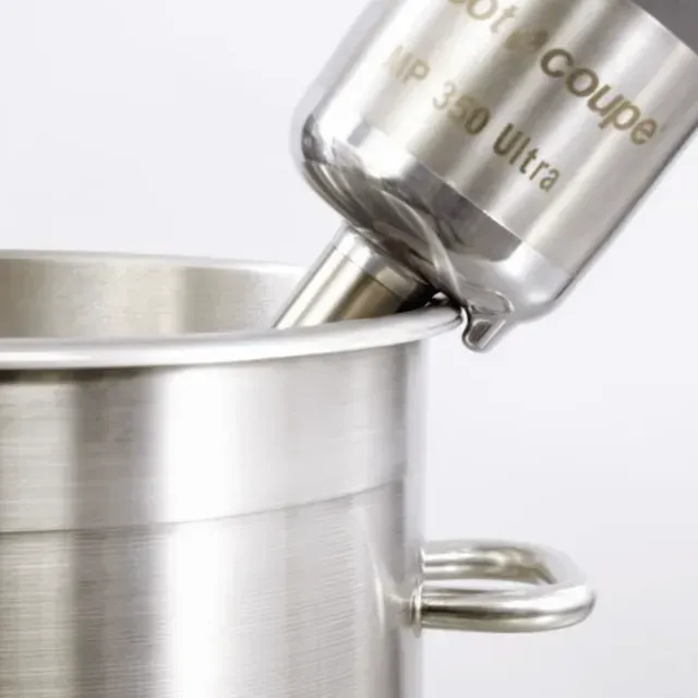 A stainless steel mixer with the word coupe on it