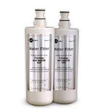 two bottles of water filter cartridges are sitting next to each other on a white surface .