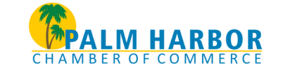 Logo of Palm Harbor Chamber of Commerce with a yellow circle, two palm trees, and blue text.