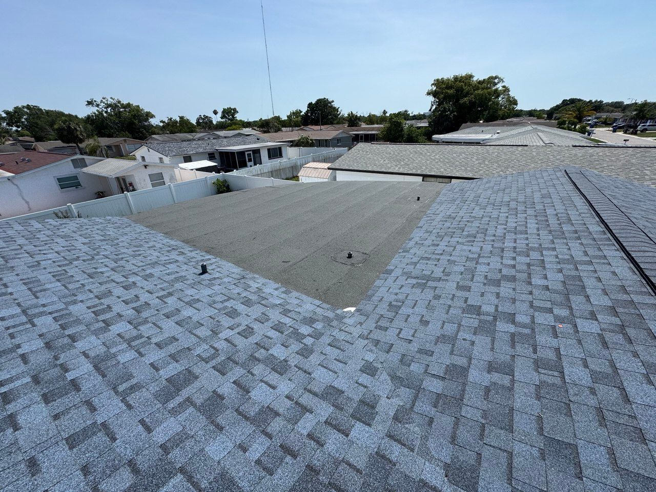 An aerial view of a house with a roof and a window.