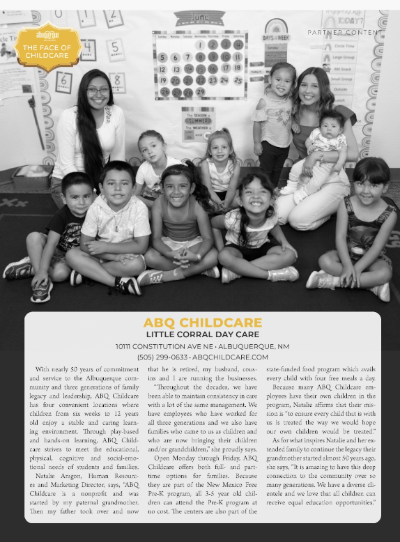 Children and teachers at ABQ Childcare. Group photo with a calendar backdrop.