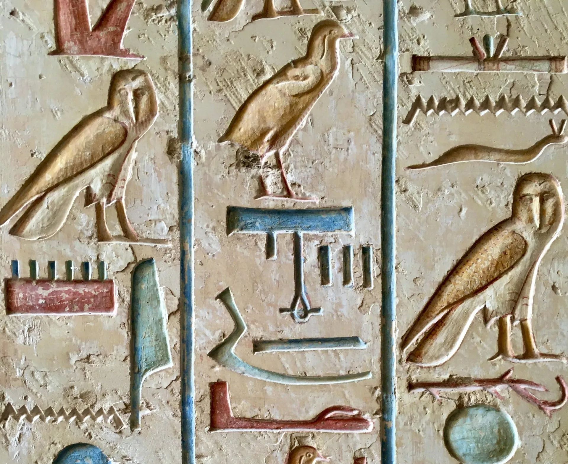 Ancient Egyptian hieroglyphics, etched into a stone tablet