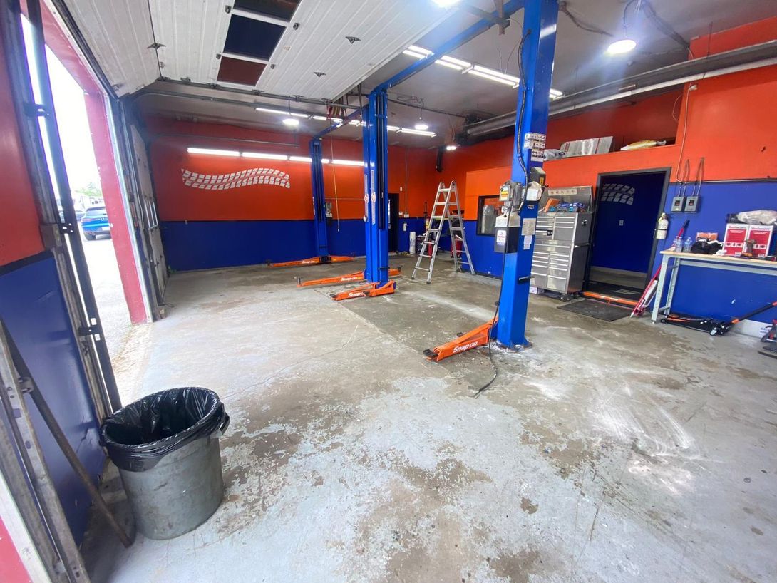 Auto Repair Shop Interior With Vehicle Lifts | North Automotive Group