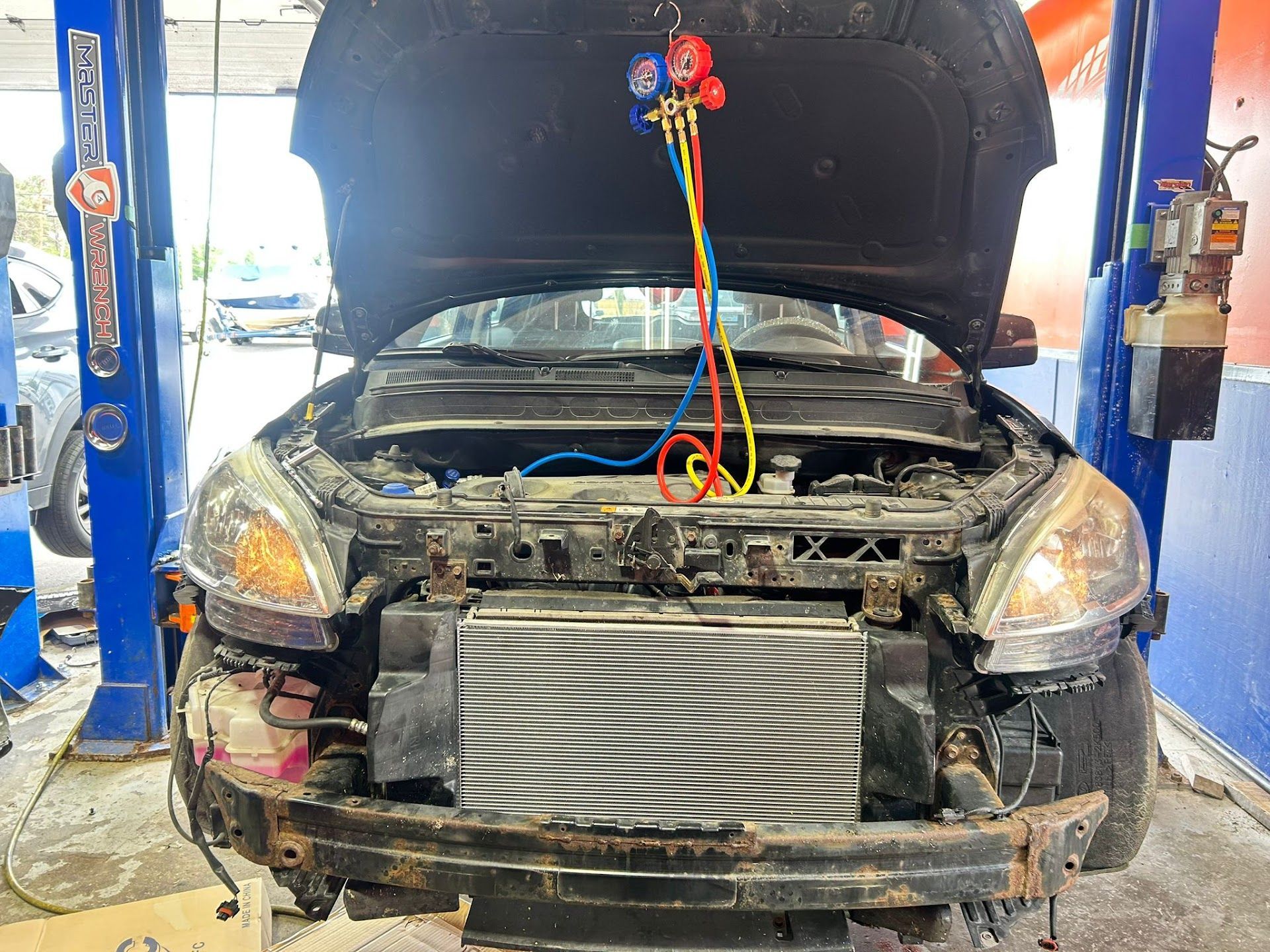 Air Conditioning Service in Progress on Compact Car | North Automotive Group