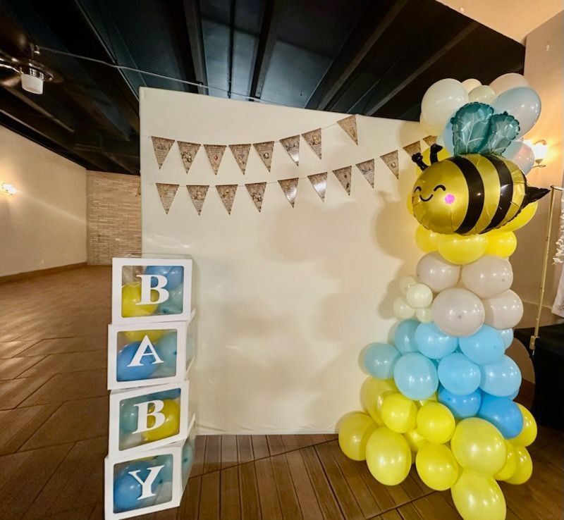 Baby shower setup: bee balloon column, 