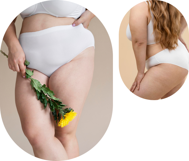 Uma mulher de cueca branca está segurando uma flor amarela