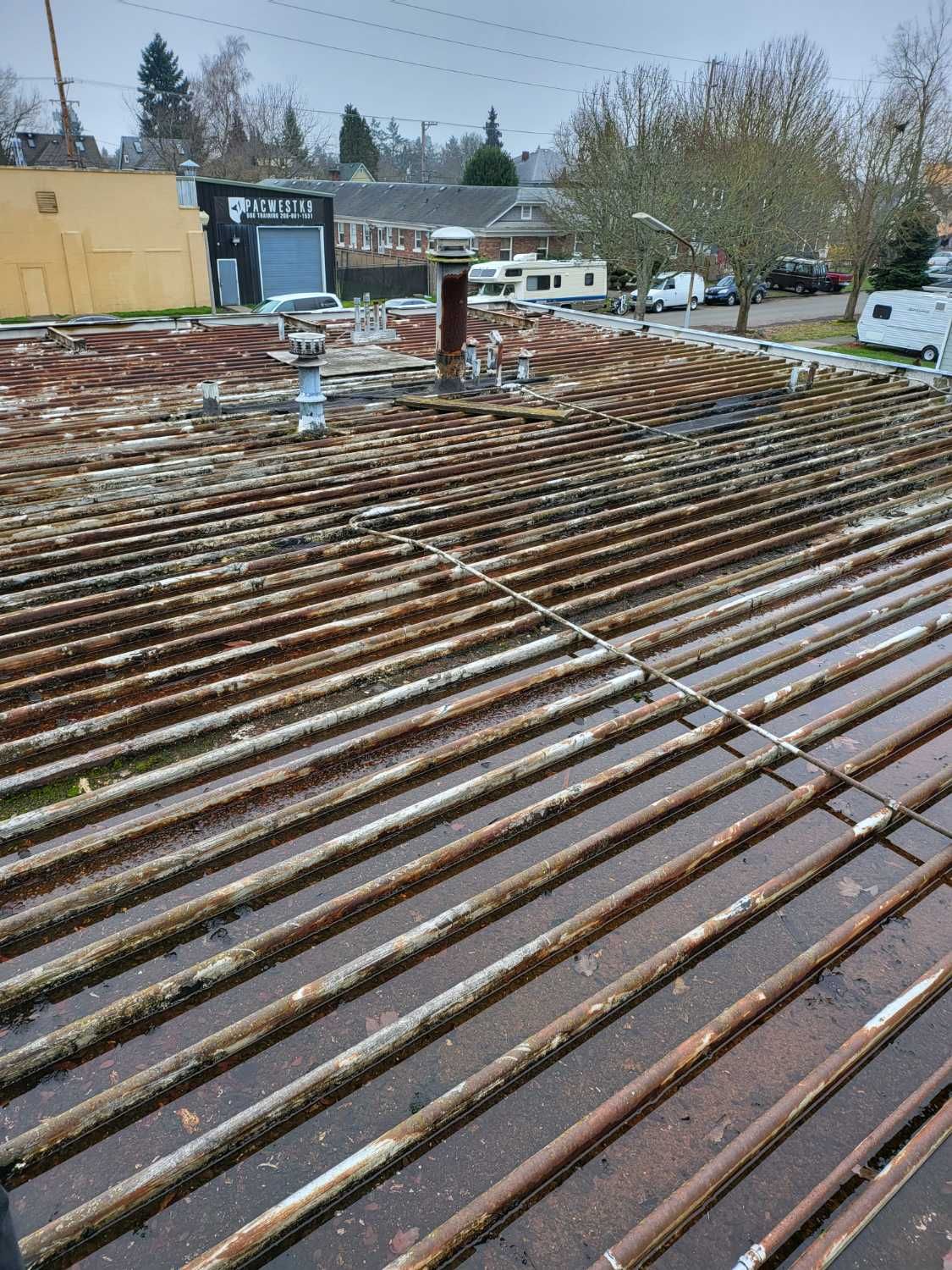 A roof with a lot of wooden beams on it.