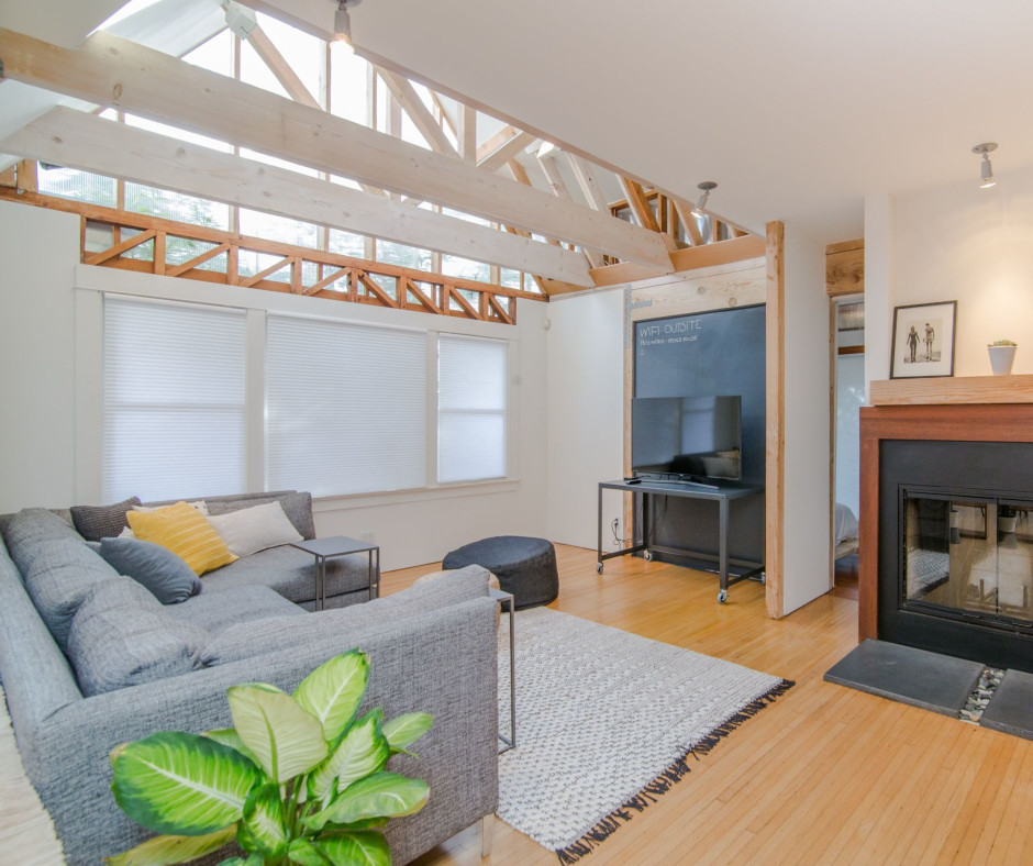 A living room with a couch and a fireplace