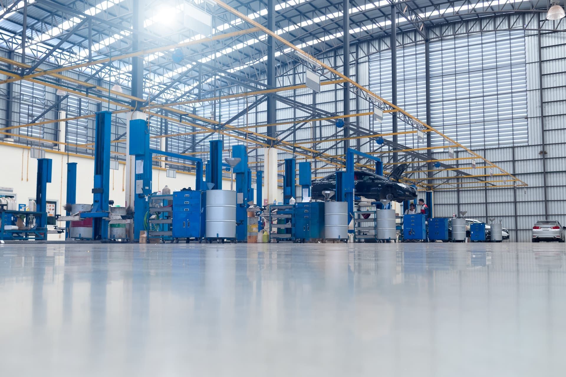 the epoxy floor in the factory, new car services, vintage tones, motion blur, car repairs, tires and batteries, Asian service centers with cars