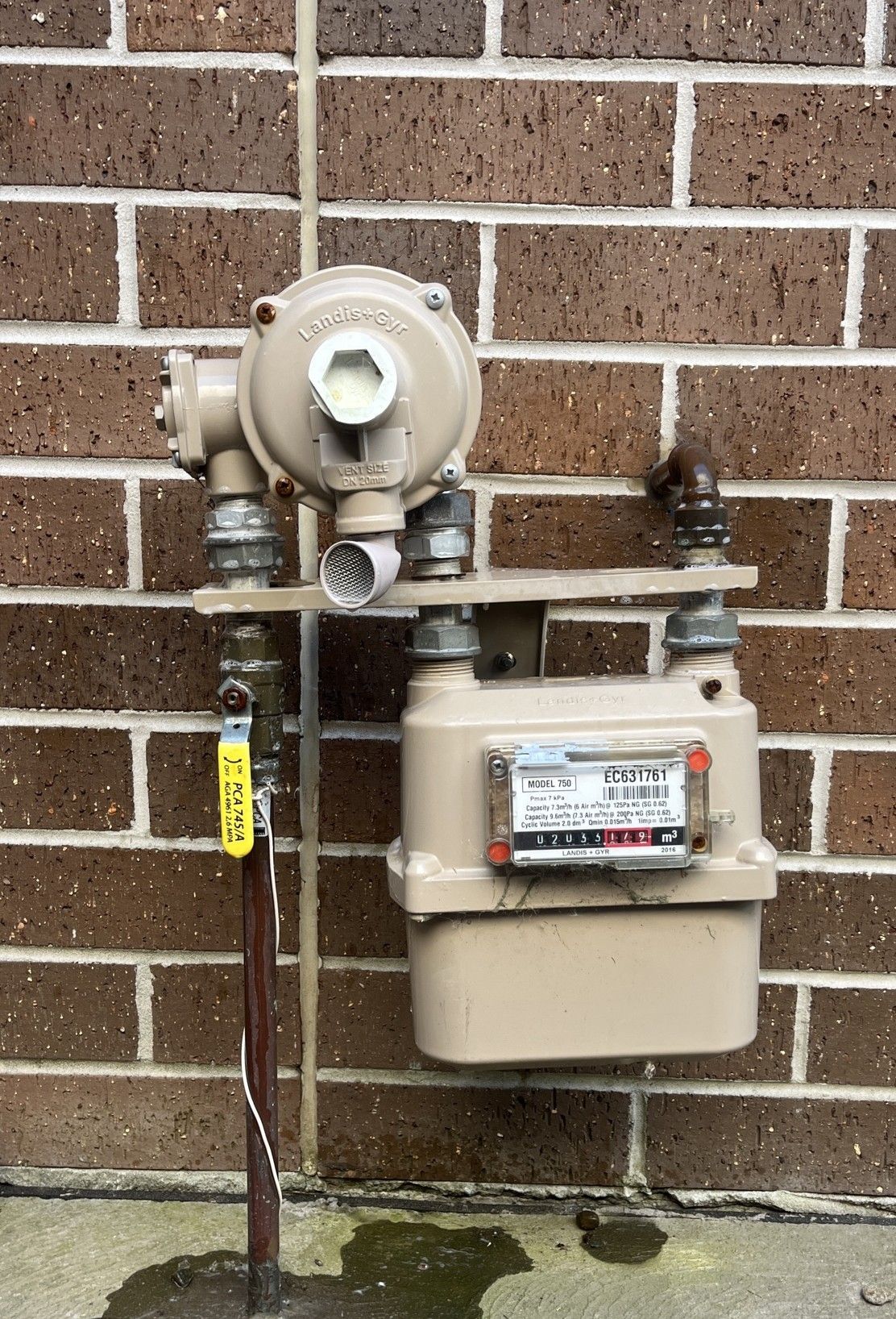 Plumbing System With Blue Valve Handles and Red Water Meters — Huddo's Plumbing Service in Wallalong, NSW