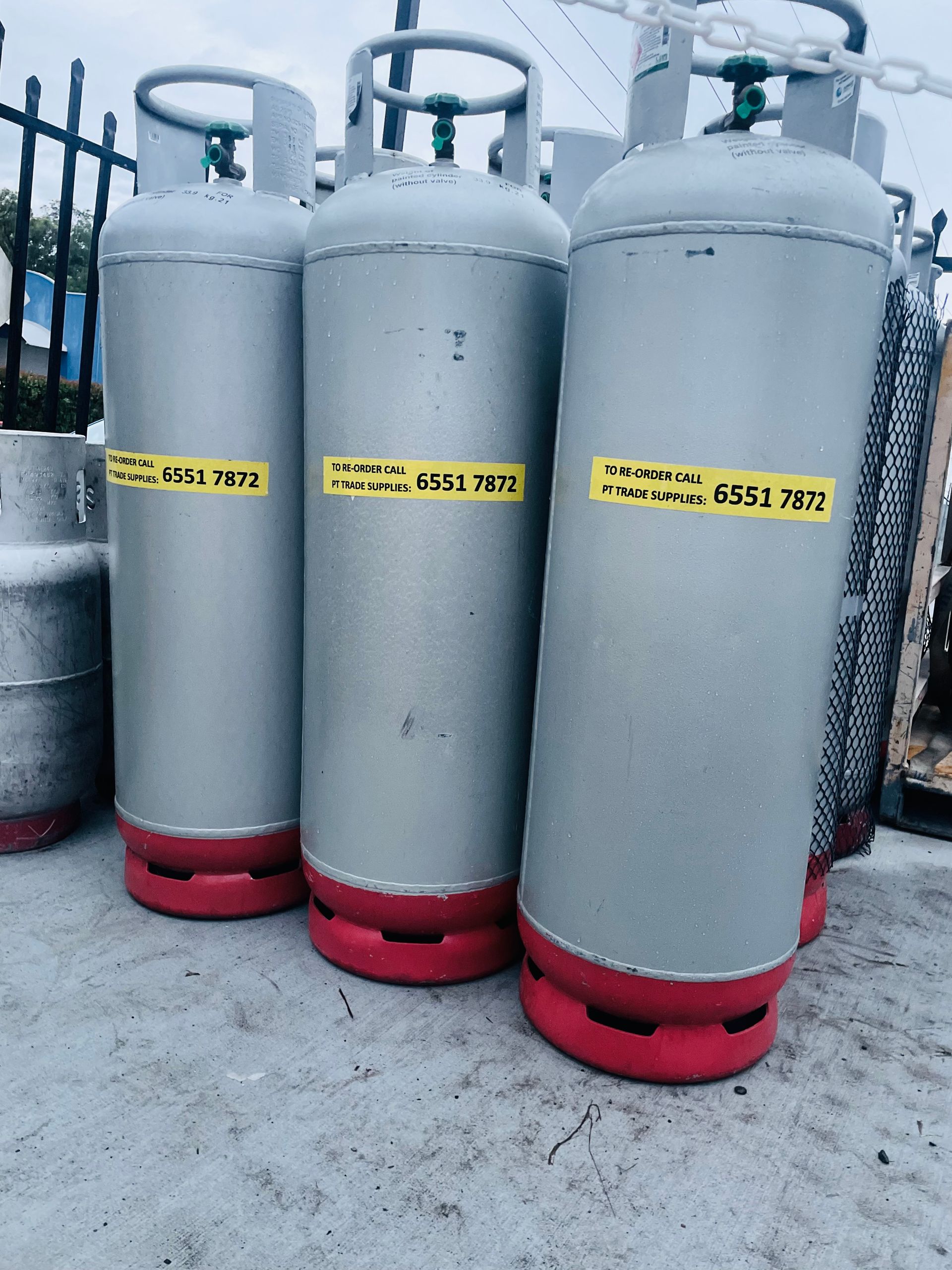 A Spray Bottle Is Sitting Next To Two Bottles Of Cleaner — PT Trade Supplies in Kempsey, NSW