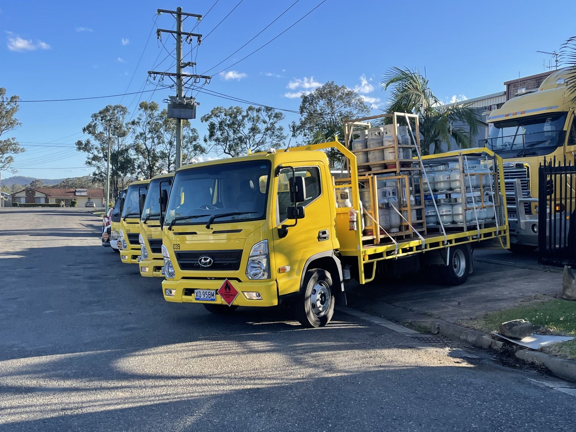 A Red Heater Is Sitting Next To A Yellow Heater — PT Trade Supplies in Gloucester, NSW