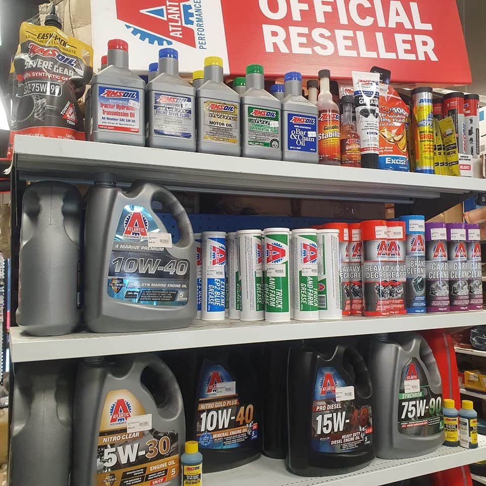 Oil Being Poured Into Car Engine — Trade Supply Services in Taree, NSW