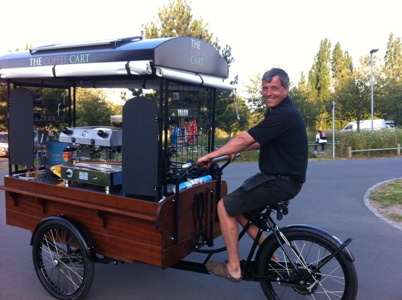man riding on the coffee cart