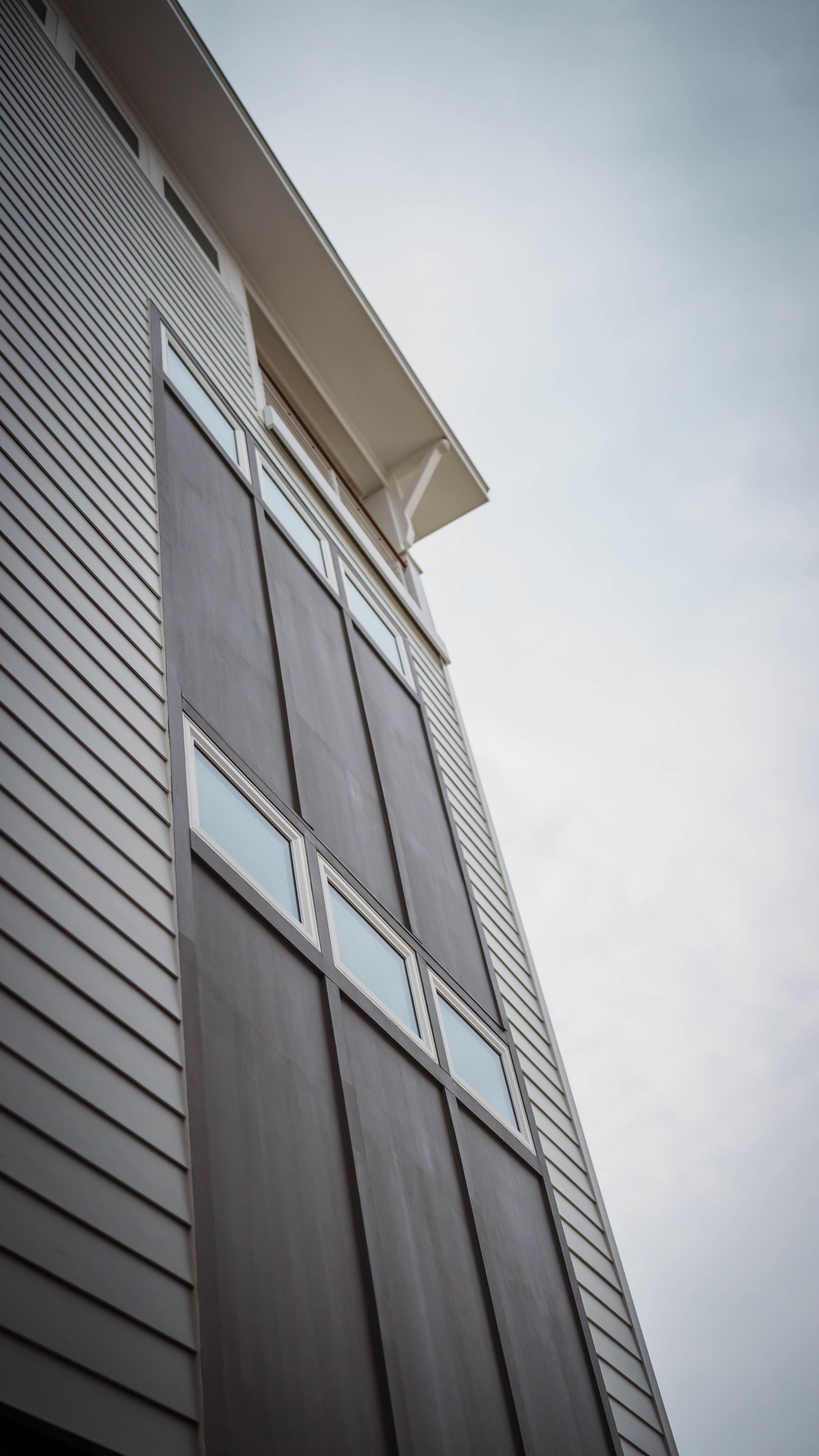 Looking up at a building with a lot of windows
