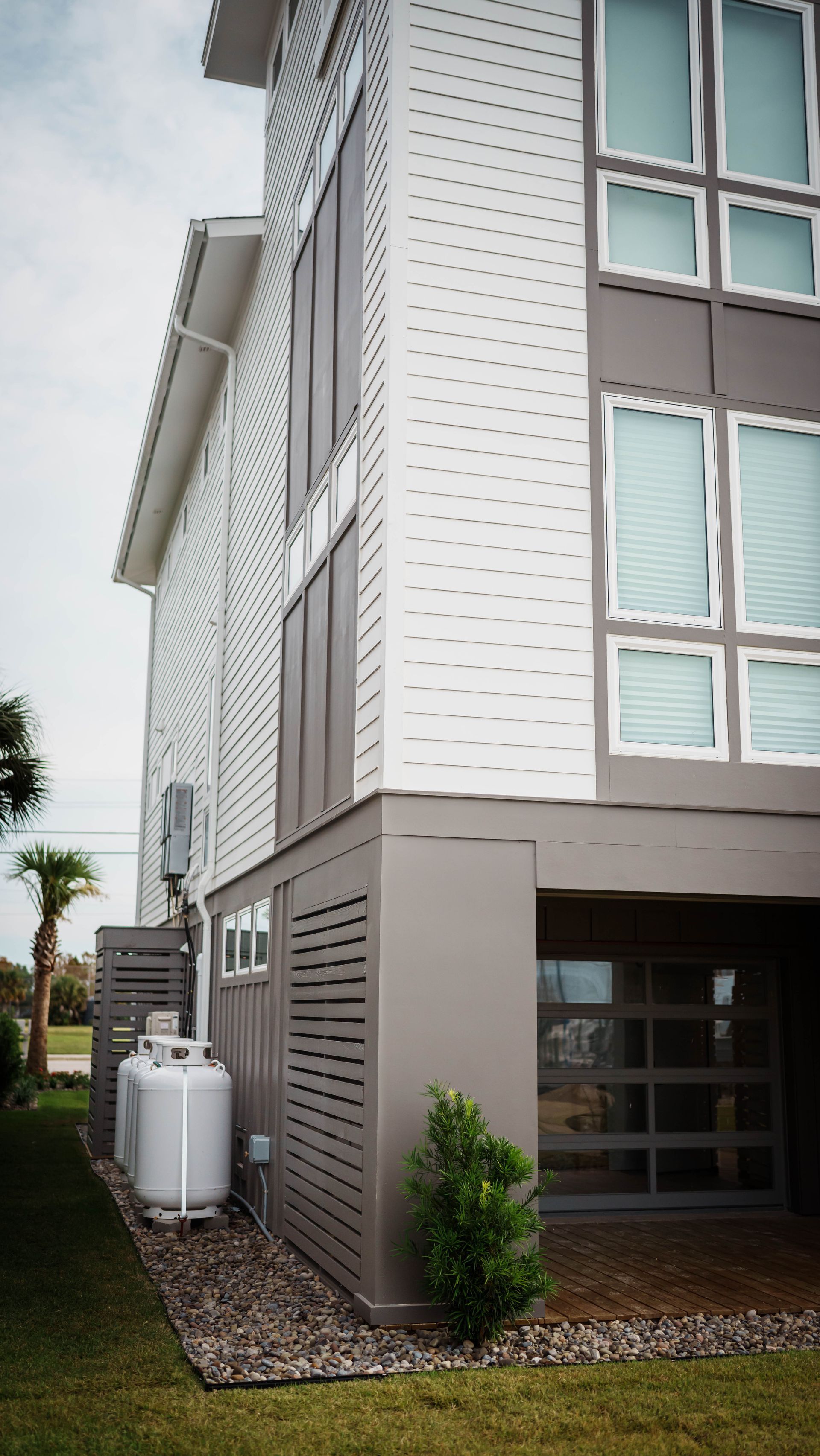 A house with a propane tank on the side of it