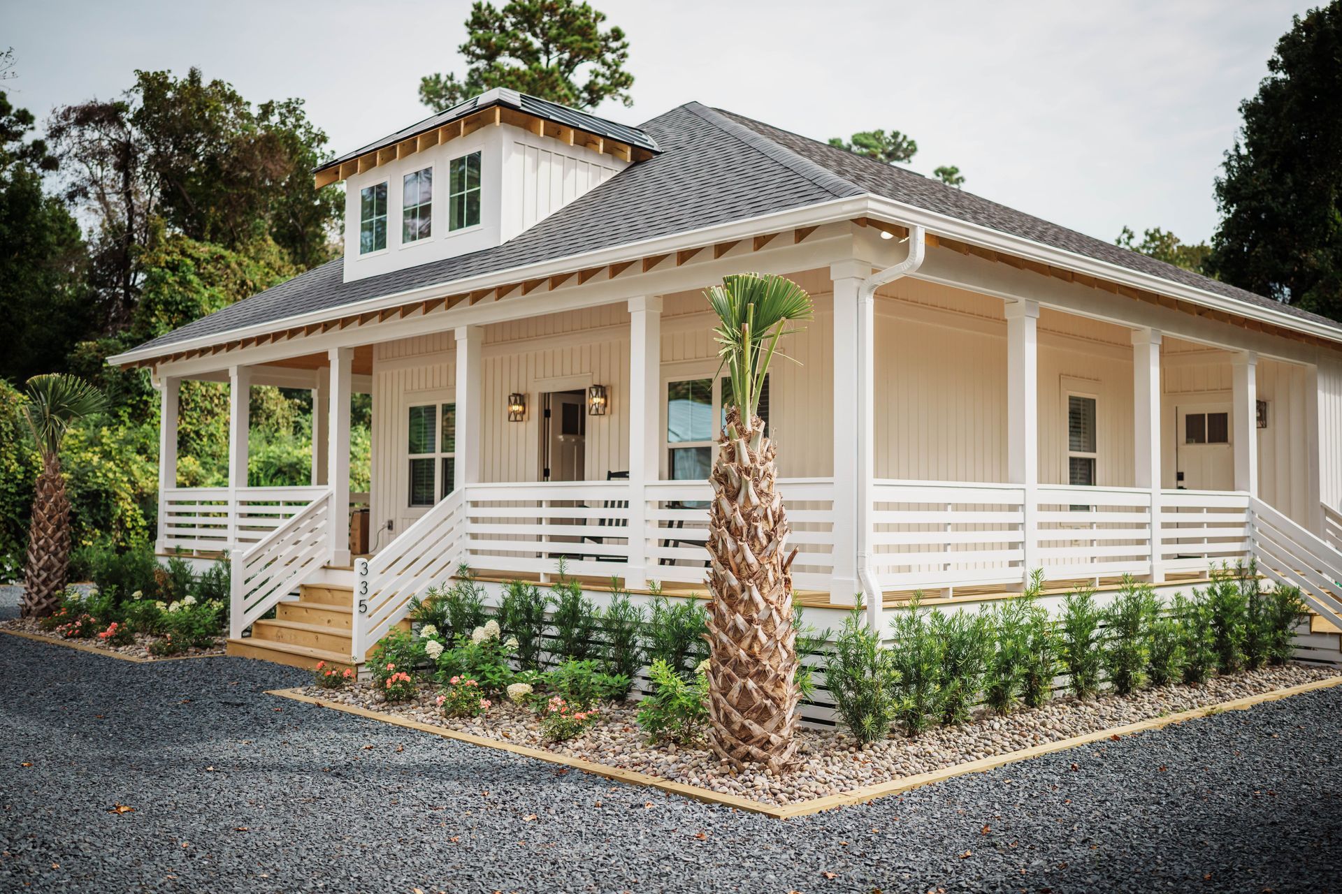 A large white house with a large porch