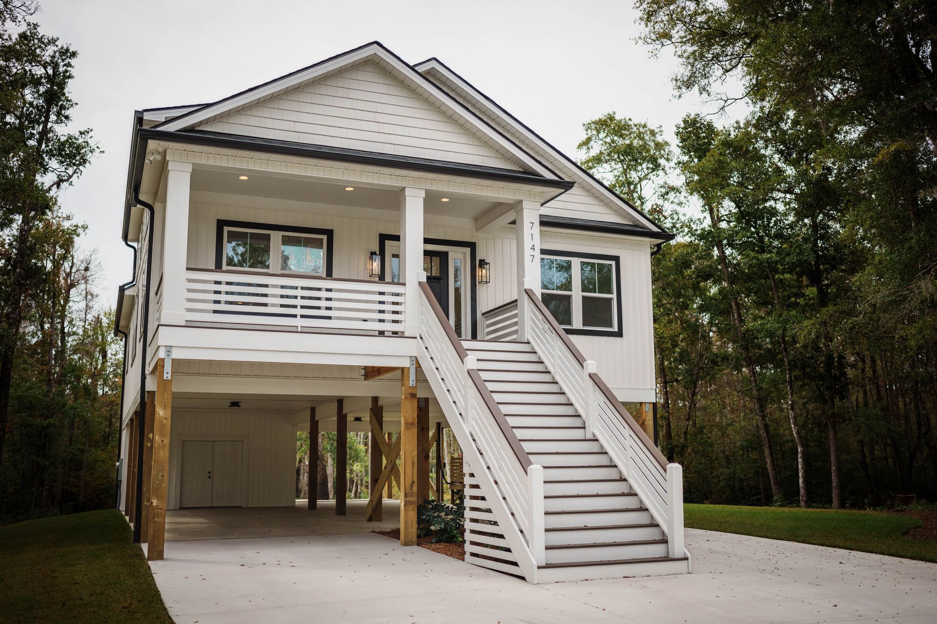 A white house with stairs leading up to it