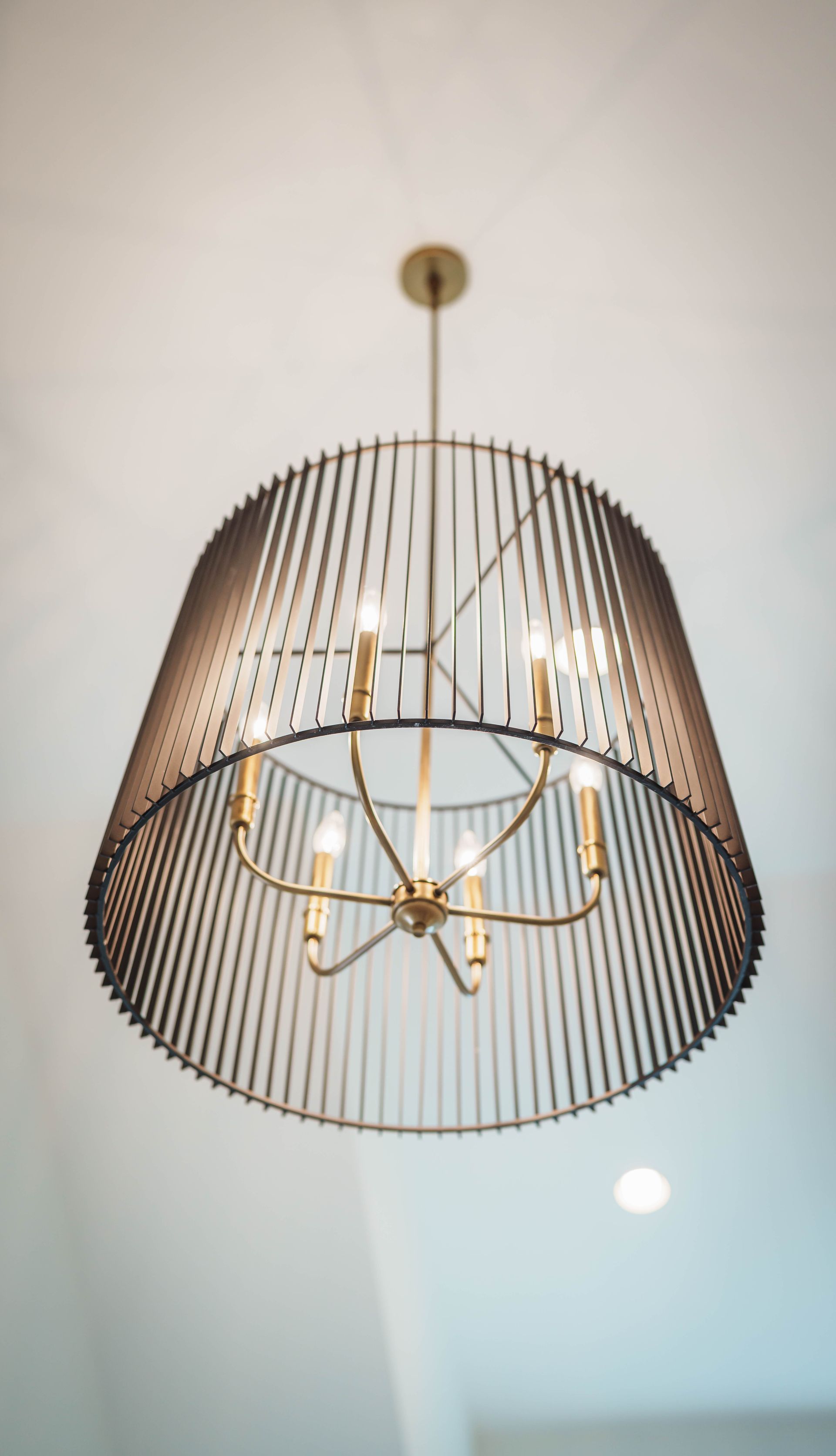 A close up of a chandelier hanging from the ceiling