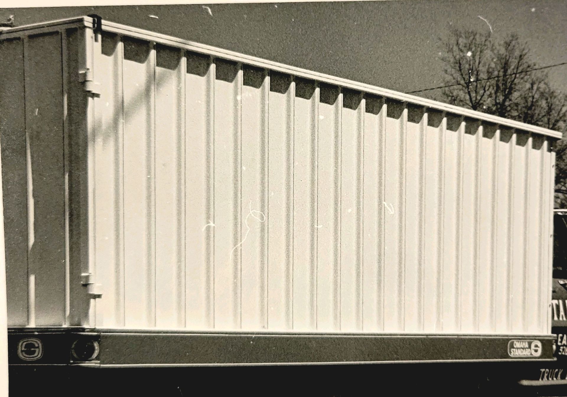 A black and white photo of a large white building