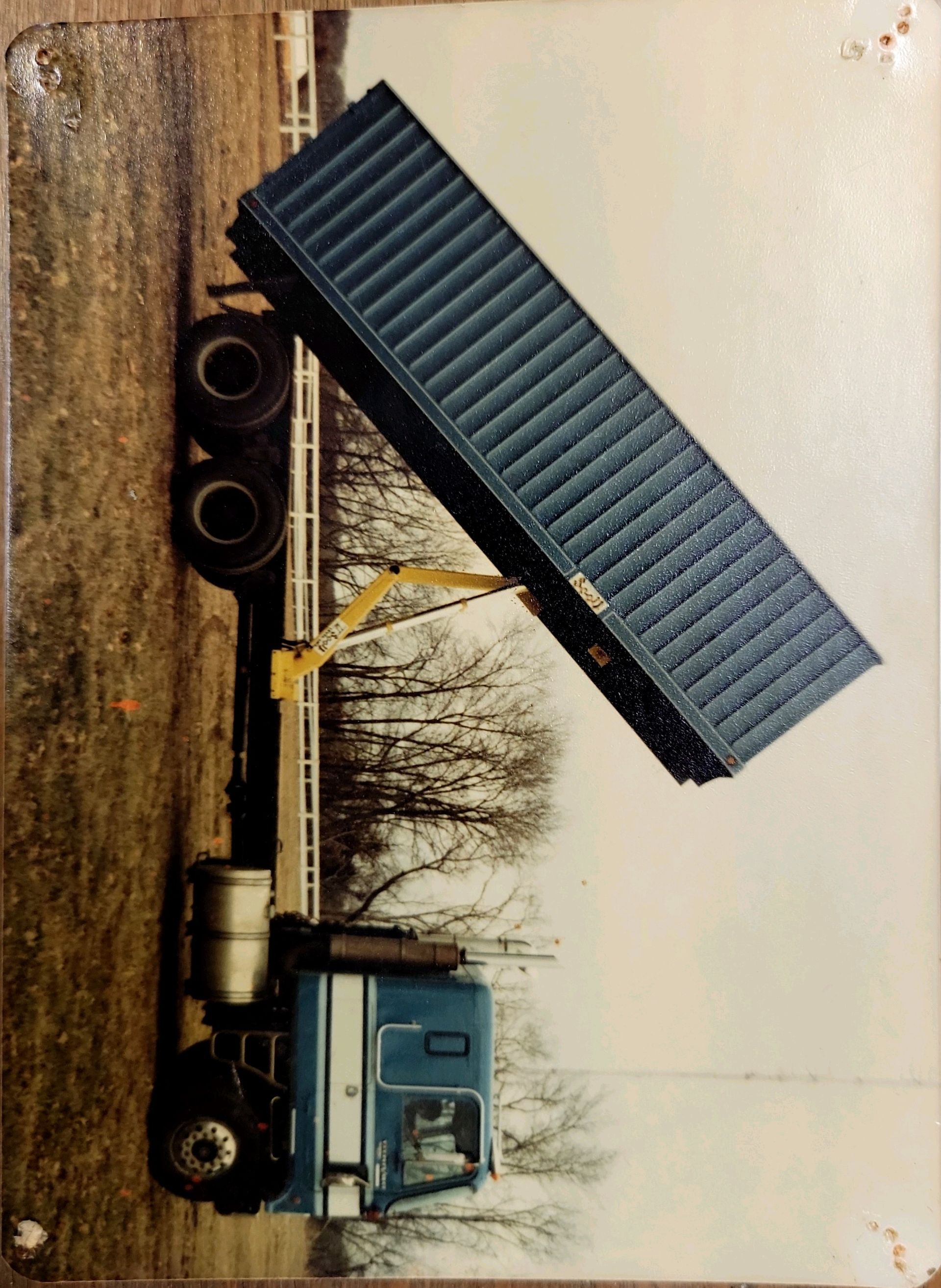 A picture of a dump truck with the number 0 on the side