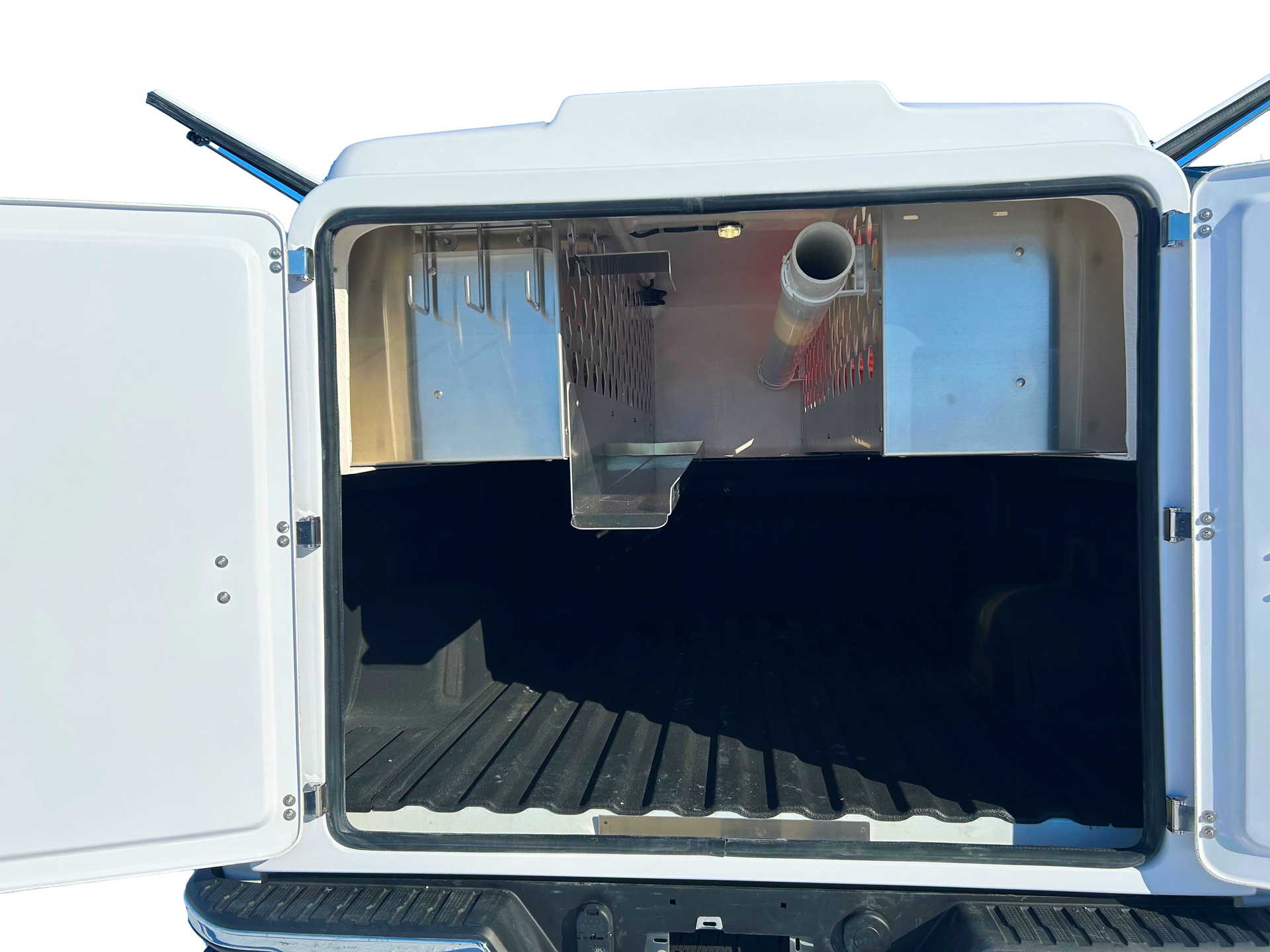 The back of a white truck with the door open.