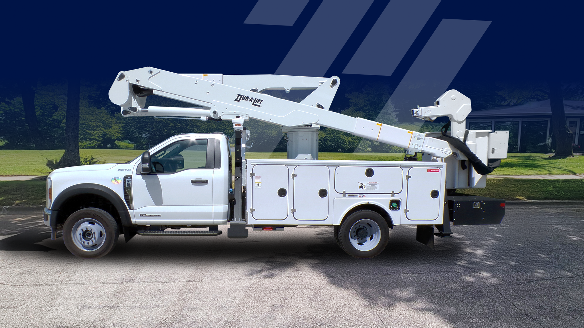 White utility truck with an aerial lift, parked on a road.