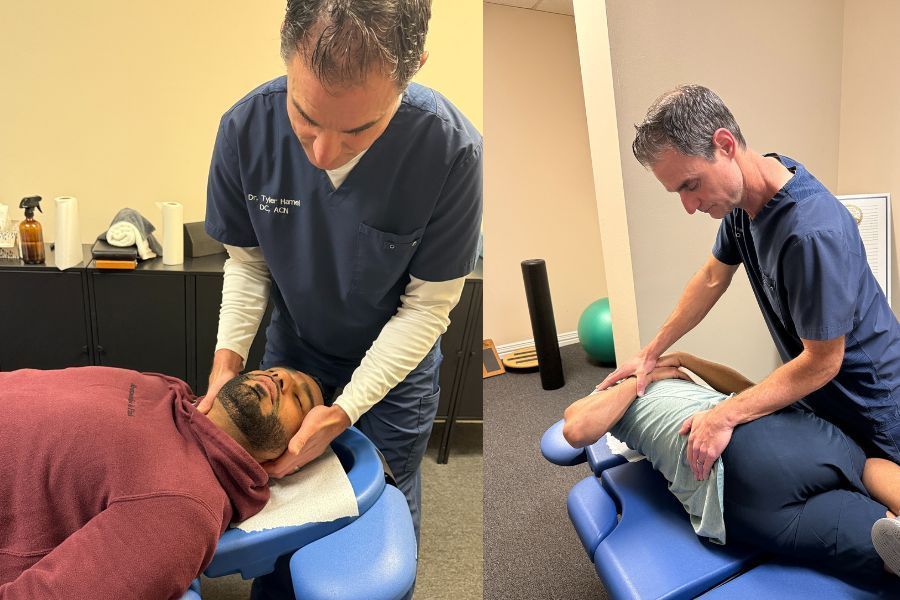 Man in blue scrubs stands next to framed certificate on a blue wall, smiling.