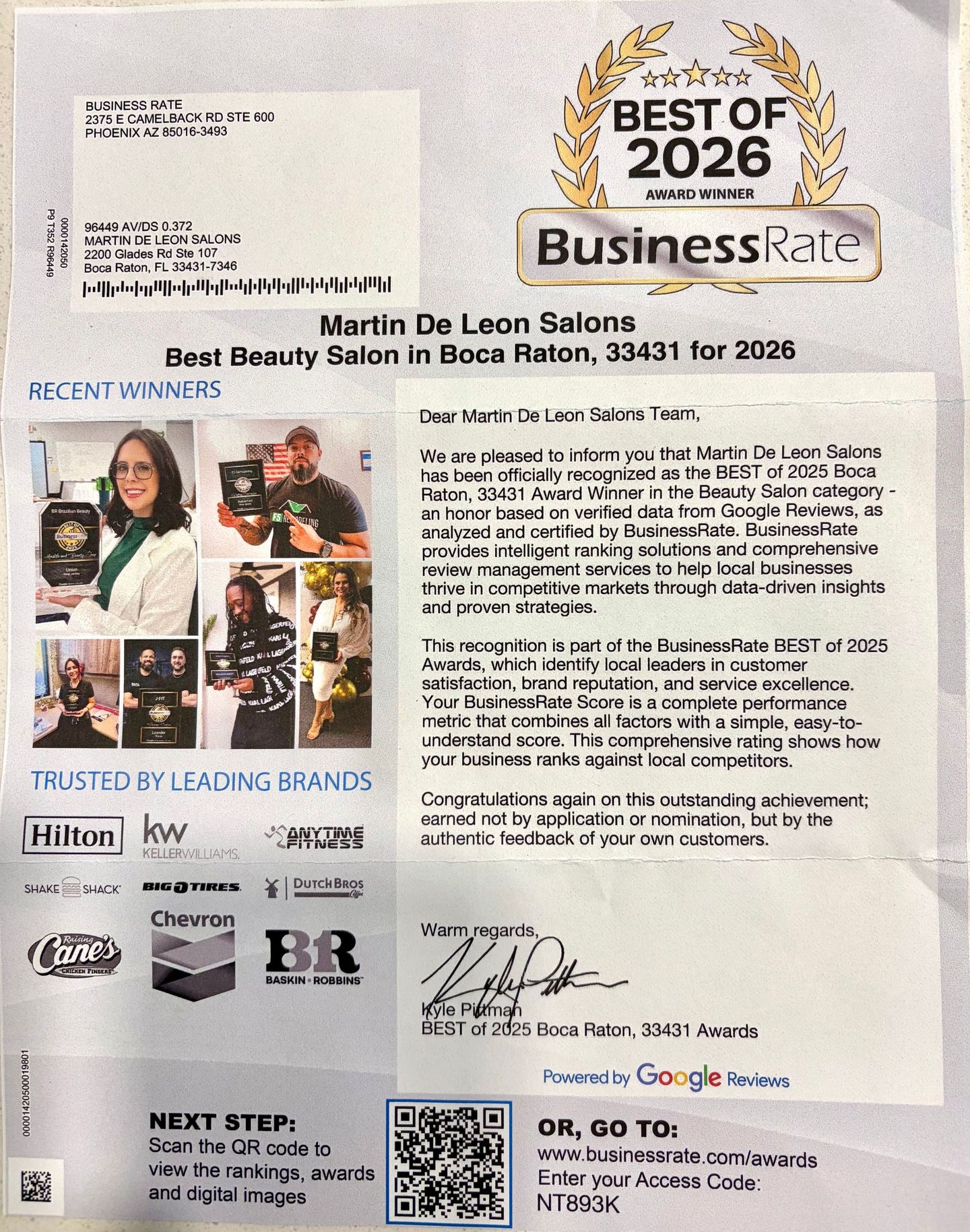 Woman with voluminous, wavy, brown hair, looking down with closed eyes.