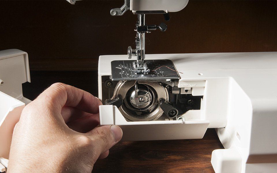 Sewing machine being threaded