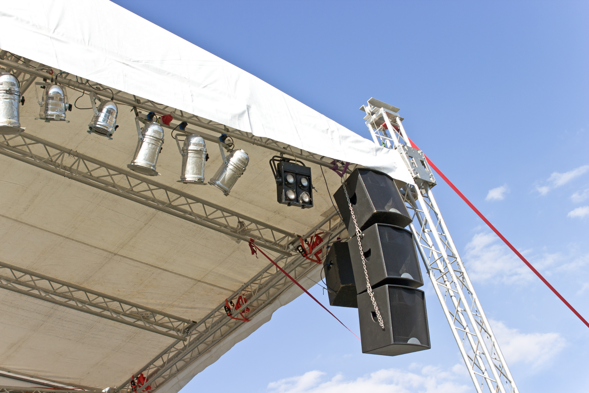 A stage with a lot of lights and speakers on it