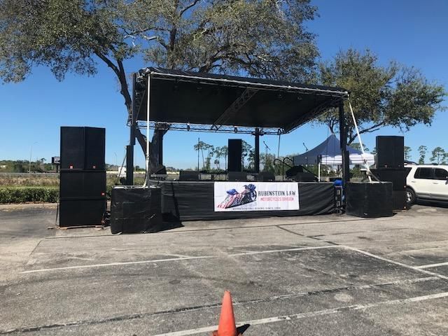 A stage in a parking lot with a sign that says marathon on it