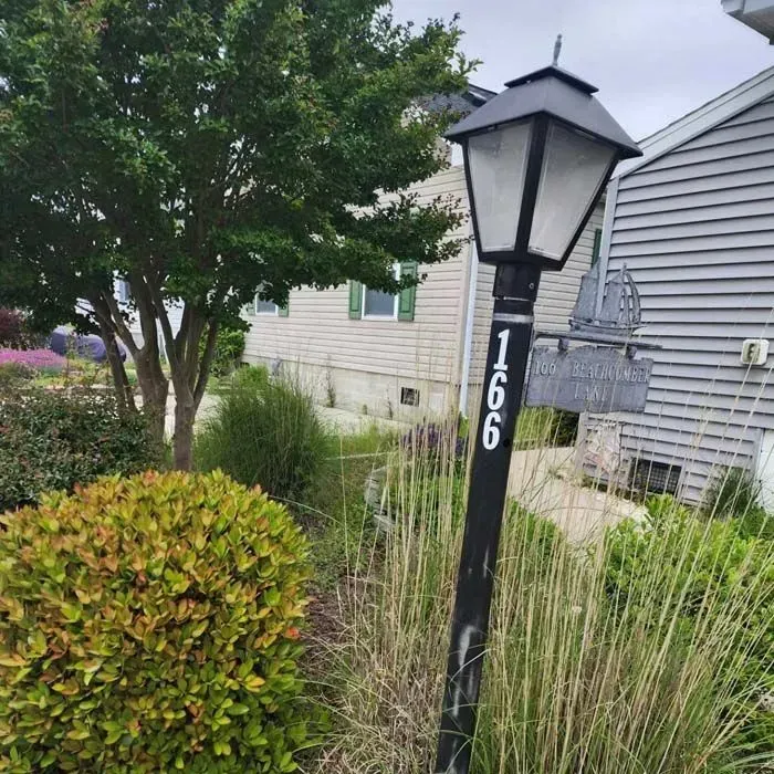 A lamp post with the number 1066 on it