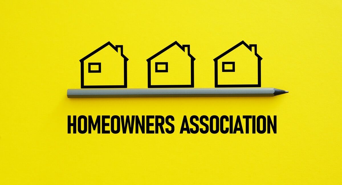 The logo for the homeowners association is a pencil with three houses drawn on it.