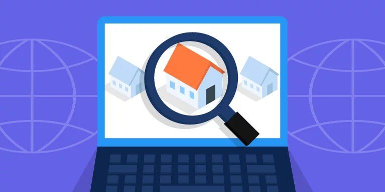 A laptop computer with a magnifying glass and a house on the screen.