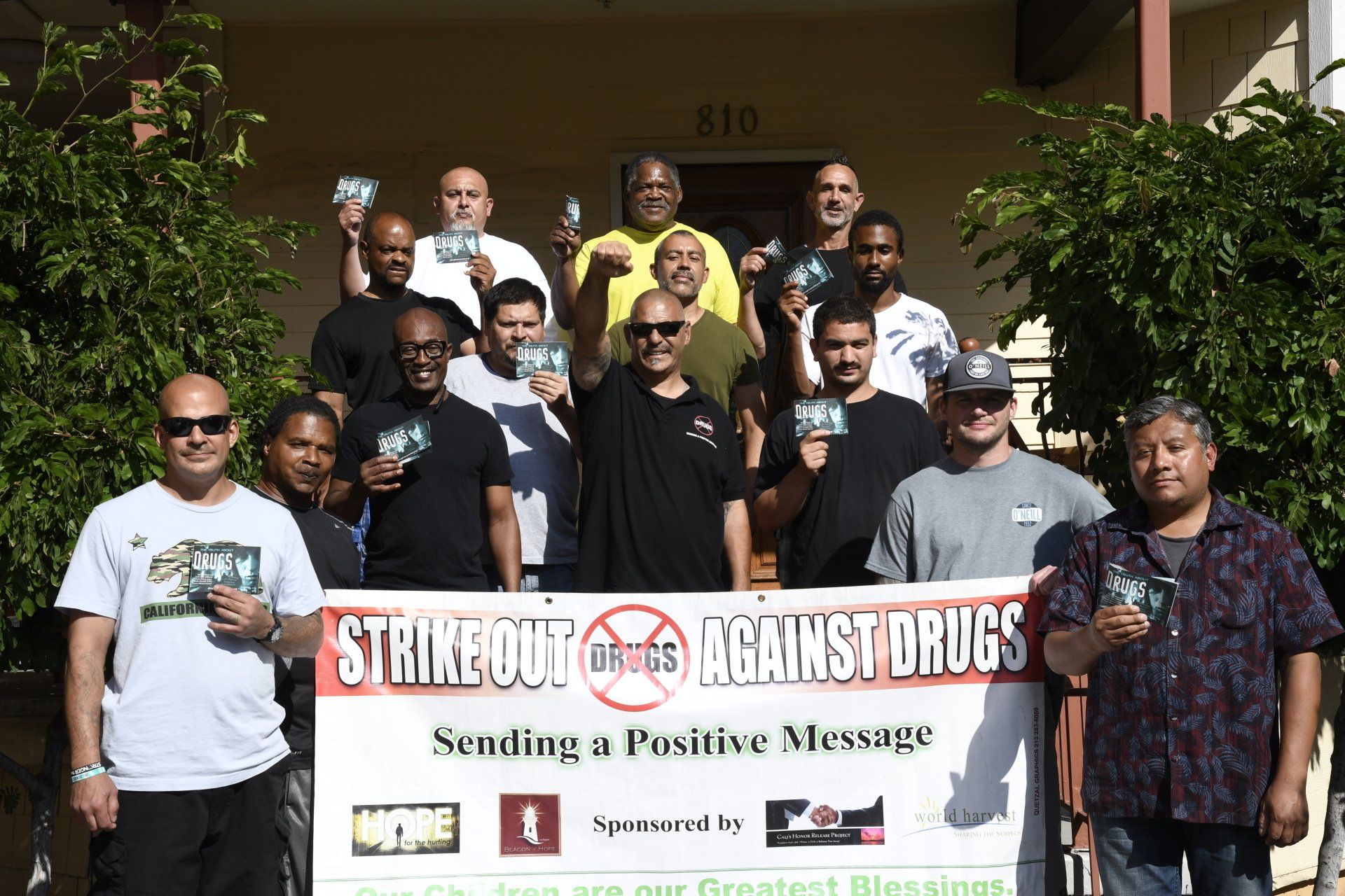 Strikout Against Drugs group holding a banner for photo