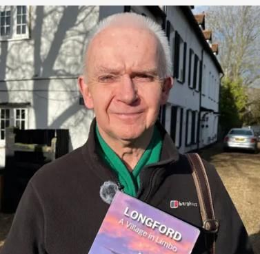 Ian Matthews in from of Grade II listed buildings in Longford. ©BBCnews