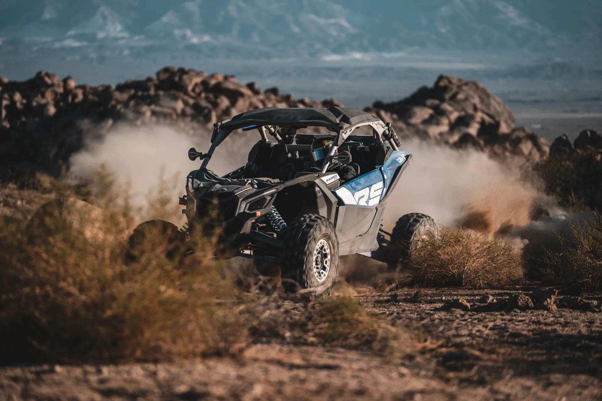 Far view of Can-Am vehicle at the mountain