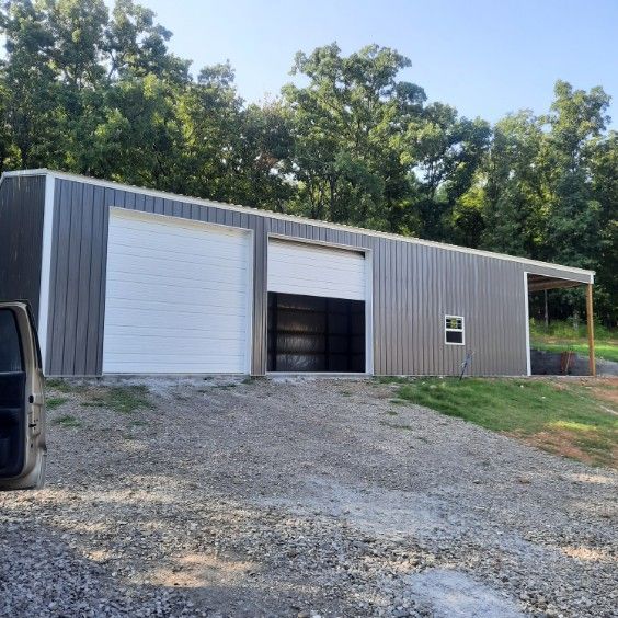 A van is parked in front of a garage with a white door