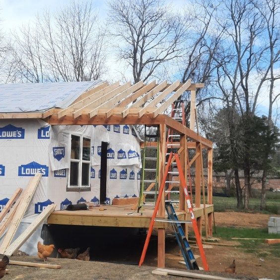 A house that is being built with a ladder in front of it