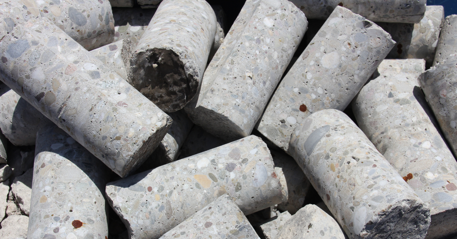 Concrete core samples extracted with a specialized drill to assess strength and material condition.
