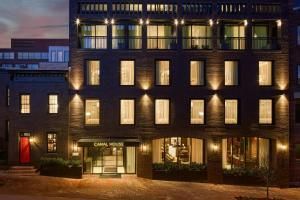 Canal House of Georgetown Tribute Portfolio Marriott opened 2025 C&O Canal boutique hotel private courtyard rowhouses Washington DC